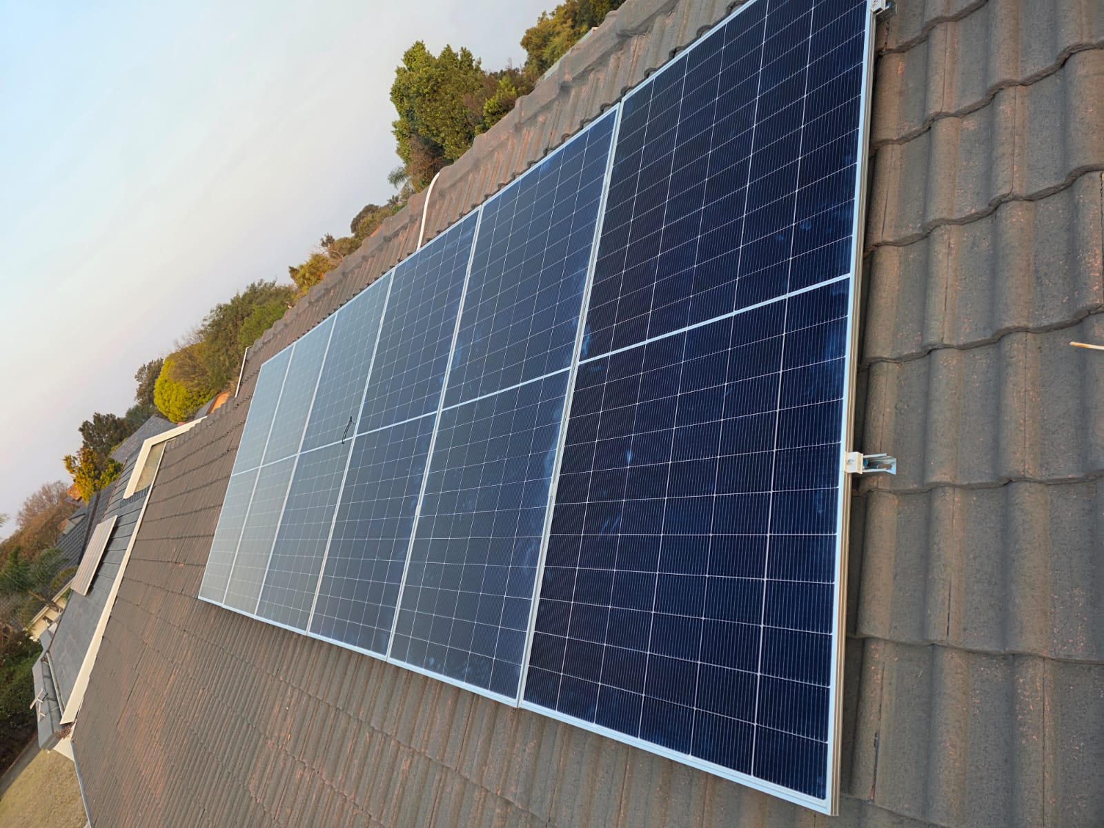 Solar panel array installed on a residential tile roof