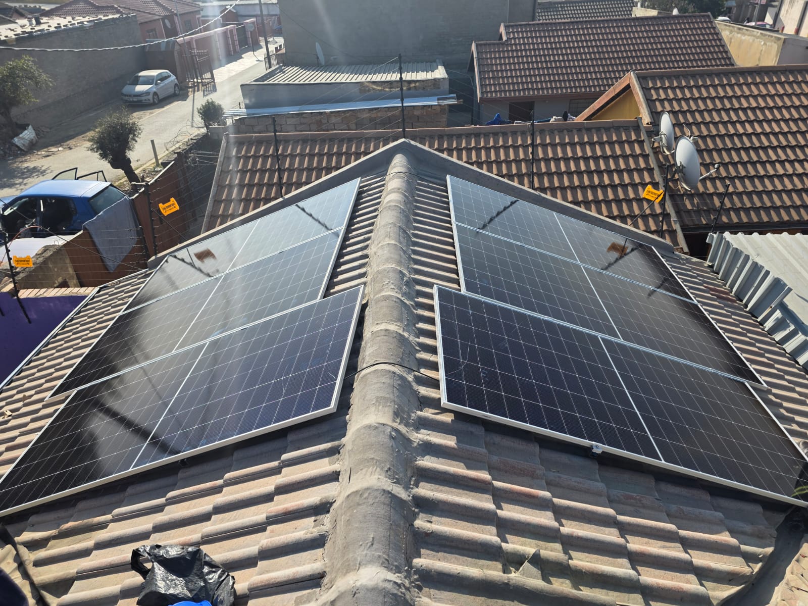 Completed solar array across a tiled roof